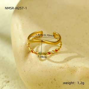 Detail of 18K gold-plated double-layer ring with wavy texture and colorful enamel accent
