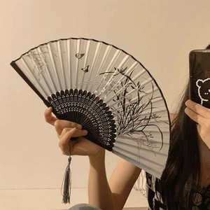 Traditional Chinese folding fan with ink butterfly print and decorative black tassel
