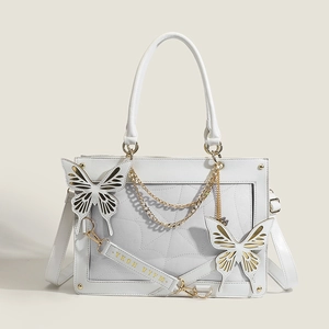 White PU leather Lolita handbag with decorative butterfly accents and golden chain strap