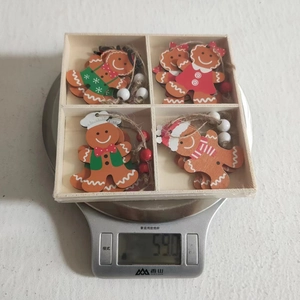 Lightweight wooden gingerbread man Christmas ornaments weighing 59g in a storage box