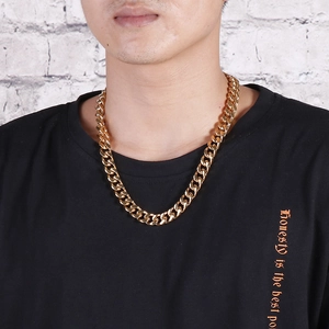 Close-up of a gold-plated stainless steel Cuban link chain necklace on a model