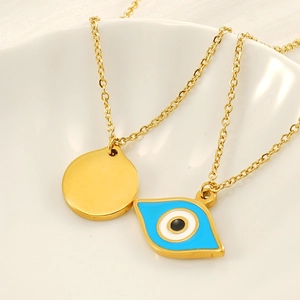 Titanium steel evil eye necklace with gold disc pendant on white ceramic plate