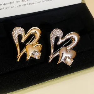 Sparkling rhinestone double heart brooch in gold and silver finish for women
