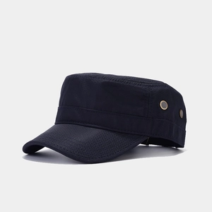 Detail of navy blue cadet cap showing hexagonal honeycomb texture and metal eyelets
