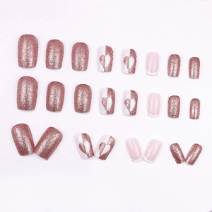 Glitter rose gold and white heart press-on nail set featuring French tips and 24 pieces