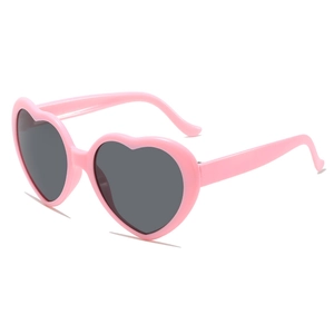 Pink heart-shaped sunglasses with dark lenses for women, stylish summer fashion accessory