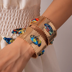 Bohemian gold metal cuff bracelet with colorful silk scarf inlay and beaded edges