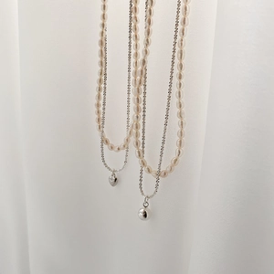 Elegant double-layered freshwater pearl necklace with silver chain and heart pendant