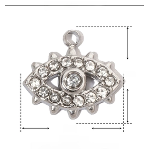 Detailed macro view of silver evil eye pendant with rhinestones and product dimensions
