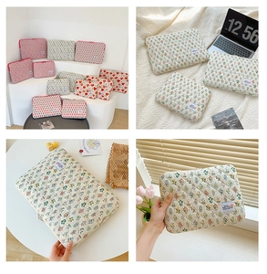 Quilted floral laptop sleeve in cotton linen fabric with secure zipper and heart patterns