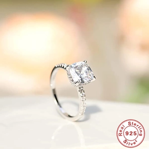 Macro shot of 925 sterling silver ring with square-cut stone and radiant shimmer