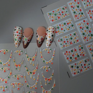 Christmas nail art sticker set with festive red and gold patterns for holiday parties