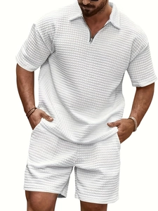 Close-up of white waffle texture fabric on men's casual polo shirt and shorts set