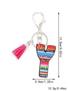 Detailed view of rainbow leopard keychain with pink tassel and precise size dimensions