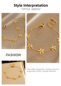 Detail of gold-plated flower bracelet with sparkling rhinestones on satin background