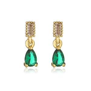 Detail of 18K gold earrings with square clear stones and green teardrop pendants