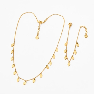 Ensemble collier et bracelet en acier titane doré avec sequins en forme de losange