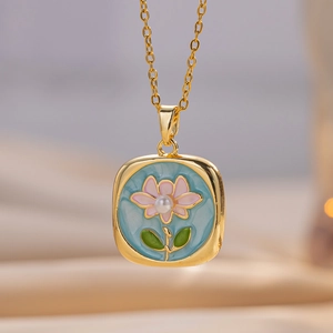 Exquisite gold enamel flower necklace with blue background and a center pearl detail