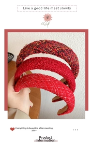 Detailed view of red tweed Christmas headbands with elegant sponge padded fabric texture