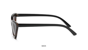 Detail view of tortoiseshell and black cat-eye sunglasses showing side hinge and frame texture