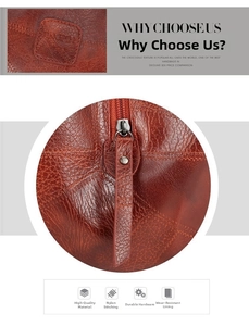 Detail of brown crocodile pattern faux leather bag with logo patch and zipper closure