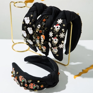 Detail of Halloween knot headbands featuring enamel ghosts, skulls and rhinestones