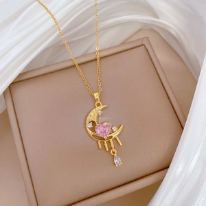 Titanium steel moon necklace with pink heart and teardrop tassels on beige box