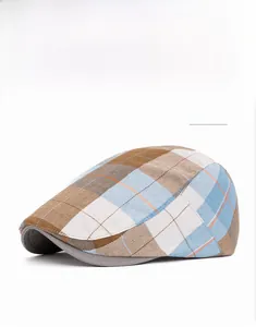 Detail view of the brown Scottish plaid pattern and premium fabric texture of the beret hat