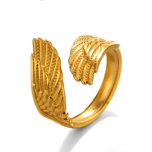 Adjustable gold feather ring in stainless steel with detailed wing texture on white background