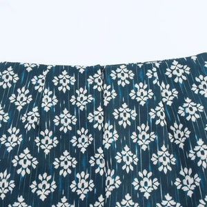 Detail view of navy blue floral print skirt showing high-quality zipper and stitching