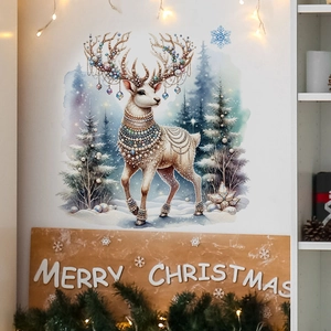 Detail of Christmas reindeer wall sticker with pearls and jewelry on a white wall decor