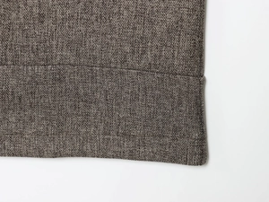 Close-up of premium herringbone twill fabric with detailed stitching and texture