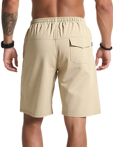 Detail view of khaki cotton shorts featuring elastic waistband and rear flap pocket