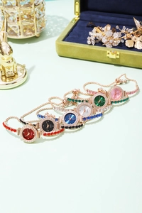 Detailed view of luxury rhinestone bracelet watches in six vibrant dial colors and rose gold