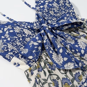 Floral print maxi dress with shirred bodice and large front bow detail in blue and white