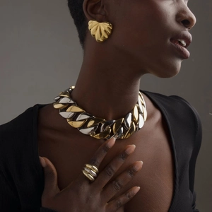 Chunky mixed metal heart earrings and Cuban chain set in gold and silver finish
