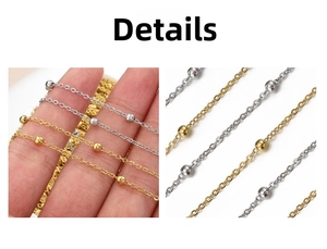 Detailed macro view of thin stainless steel bead chains in gold and silver finishes