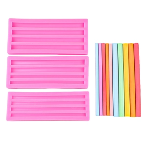 Three pink silicone molds with five rectangular slots for DIY wax strips and fondant cake decor
