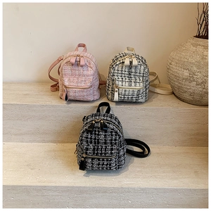 Detailed trio of mini tweed backpacks in pink, black, and checkered woven textures