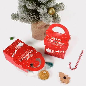 Detail of red Christmas gift boxes with Merry Christmas print and reindeer patterns