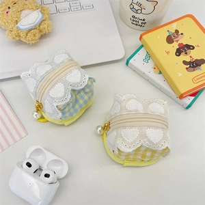 Close-up of cute plaid fabric earphone case with lace trim and pearl zipper pendant