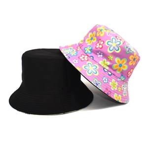 Reversible floral pattern sun bucket hat for men and women in black and pink cotton