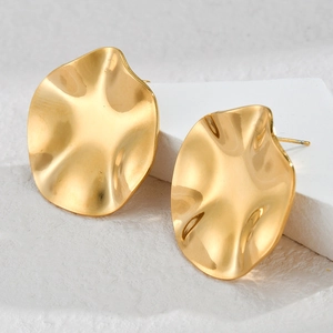 Golden 18K plated stainless steel earrings with irregular wave texture on white stone