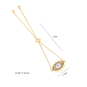Macro detail of gold devil's eye bracelet with zircons and 24cm adjustable chain length