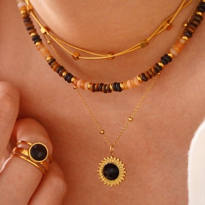 14K gold plated layered necklace with black onyx sunburst pendant and beaded chains