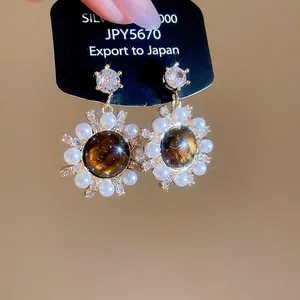 Vintage sunflower stud earrings with tiger eye stone, pearls and zircon in gold finish