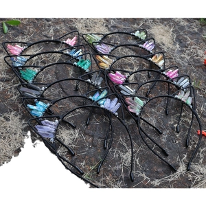 Cat ear headbands with natural colorful crystals wrapped in silver wire on outdoor ground