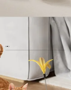 Tumbler cat toy featuring a smooth double-ball track and a flexible yellow feather wand