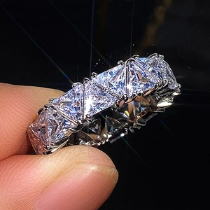 Silver eternity ring with full row of claw-set triangle cut cubic zirconia stones