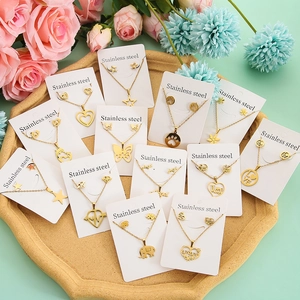Golden stainless steel necklace and earrings sets with assorted star and heart pendants